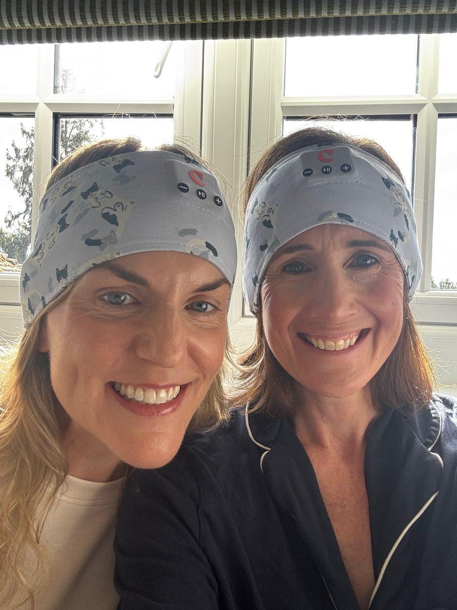 Kim and a friend taking a selfie on shoot day, both wearing the band